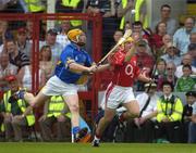26 June 2005; Joe Deane, Cork, in action against Eamonn Corcoran, Tipperary. Guinness Munster Senior Hurling Championship Final, Cork v Tipperary, Pairc Ui Chaoimh, Cork. Picture Credit; Ray McManus / SPORTSFILE