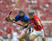 26 June 2005; Ben O'Connor, Cork, in action against, Paul Curran, Tipperary. Guinness Munster Senior Hurling Championship Final, Cork v Tipperary, Pairc Ui Chaoimh, Cork. Picture Credit; Ray McManus / SPORTSFILE