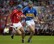 26 June 2005; Tom Kenny, Cork, in action against Declan Fanning, Tipperary. Guinness Munster Senior Hurling Championship Final, Cork v Tipperary, Pairc Ui Chaoimh, Cork. Picture Credit; Ray McManus / SPORTSFILE