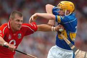 26 June 2005; Diarmuid O'Sullivan, Cork, in action against Evan Sweeney, Tipperary. Guinness Munster Senior Hurling Championship Final, Cork v Tipperary, Pairc Ui Chaoimh, Cork. Picture Credit; David Levingstone / SPORTSFILE