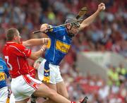 26 June 2005; Micheal Webster, Tipperary, is tackled by Diarmuid O'Sullivan, Cork, which resulted in a penalty being awarded by the referee. Guinness Munster Senior Hurling Championship Final, Cork v Tipperary, Pairc Ui Chaoimh, Cork. Picture Credit; David Levingstone / SPORTSFILE