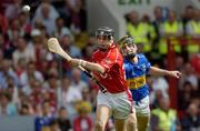 26 June 2005; Neil Ronan, Cork, in action against Paul Curran, Tipperary. Guinness Munster Senior Hurling Championship Final, Cork v Tipperary, Pairc Ui Chaoimh, Cork. Picture Credit; Ray McManus / SPORTSFILE