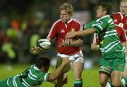28 June 2005; Ollie Smith, British and Irish Lions, is tackled by Matt Oldridge, left, and Johnny Leota, Manawatu. British and Irish Lions Tour to New Zealand 2005, Manawatu v British and Irish Lions, Arena Manawatu, Palmerston North, New Zealand. Picture credit; Brendan Moran / SPORTSFILE