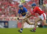 26 June 2005; Benny Dunne, Tipperary, in action against Tom Kenny, Cork. Guinness Munster Senior Hurling Championship Final, Cork v Tipperary, Pairc Ui Chaoimh, Cork. Picture Credit; Ray McManus / SPORTSFILE