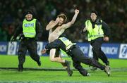 28 June 2005; A streaker is tackled by Police during the game. British and Irish Lions Tour to New Zealand 2005, Manawatu v British and Irish Lions, Arena Manawatu, New Zealand, Palmerston Northd, New Zealand. Picture credit; Brendan Moran / SPORTSFILE