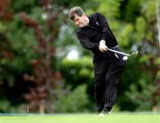 29 June 2005; JP McManus, drives from the15th tee box during the Smurfit European Open Pro-Am. K Club, Straffan, Co. Kildare. Picture credit; David Maher / SPORTSFILE