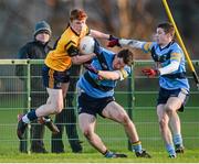 13 February 2014; Conor McHugh, Dublin City University, in action against Paraic O'Harnan, left, and Ryan Wylie, University College Dublin. Irish Daily Mail HE GAA Sigerson Cup 2014, Quarter-Final, University College Dublin v Dublin City University, UCD, Belfield, Dublin. Picture credit: Pat Murphy / SPORTSFILE