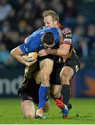 14 February 2014; Noel Reid, Leinster, is tackled by Matthew Pewtner and Ashley Smith, right, Newport Gwent Dragons. Celtic League 2013/14 Round 14, Leinster v Newport Gwent Dragons, RDS, Ballsbridge, Dublin. Picture credit: Ramsey Cardy / SPORTSFILE