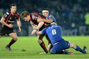 14 February 2014; Matthew Pewtner, Newport Gwent Dragons, is tackled by Rhys Ruddock, 6, and Mike McCarthy, Leinster. Celtic League 2013/14 Round 14, Leinster v Newport Gwent Dragons, RDS, Ballsbridge, Dublin. Picture credit: Ray Lohan / SPORTSFILE