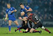 14 February 2014; Noel Reid, Leinster, is tackled by Jevon Groves and T. Rhys Thomas, 2, Newport Gwent Dragons. Celtic League 2013/14 Round 14, Leinster v Newport Gwent Dragons, RDS, Ballsbridge, Dublin. Picture credit: Ramsey Cardy / SPORTSFILE