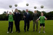 23 June 2005; The Minister for Arts, Sport and Tourism, Mr. John O'Donoghue T.D., centre, today announced an allocation of 2 million euro from the Irish Sports Council to the FAI for 2005 aimed at supporting their Technical Development Plan, with a particular emphasis on participation in soccer at underage level. With the Minister at the announcement are sixth class students from Gaelscoil Na Rithe, Dunshauglin, Co. Meath, Eihmin Kinsella, left, and Amy Ennis, Chief Executive of the FAI John Delaney, and Irish Sports Council Chief Executive John Treacy. Parkside Sports Community Centre, Cabra, Dublin. Picture credit; Brian Lawless / SPORTSFILE