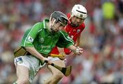 26 June 2005; Diarmuid O'Sullivan, Limerick, in action against Ger O'Driscoll, Cork. Munster Minor Hurling Championship Final, Cork v Limerick, Pairc Ui Chaoimh, Cork. Picture Credit; Ray McManus / SPORTSFILE