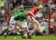 26 June 2005; Seamus Hickey, Limerick, in action against Cathal Naughton, Cork. Munster Minor Hurling Championship Final, Cork v Limerick, Pairc Ui Chaoimh, Cork. Picture Credit; Ray McManus / SPORTSFILE
