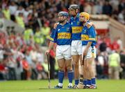 26 June 2005; Tipperary's Eoin kelly, left, Michael Webster, centre, and Lar Corbett stand for the national anthem. Guinness Munster Senior Hurling Championship Final, Cork v Tipperary, Pairc Ui Chaoimh, Cork. Picture Credit; David Levingstone / SPORTSFILE