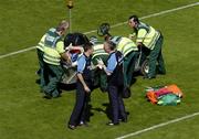 19 June 2005; John Murphy, left, Chartered Physiotherapist, Dublin, and Professor Gerry McElvaney, Dublin team doctor, in conversation as Dublin's Stephen O'Shaughnessy is stretchered off. Bank of Ireland Leinster Senior Football Championship Semi-Final, Dublin v Wexford, Croke Park, Dublin. Picture credit; Brian Lawless / SPORTSFILE