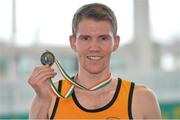 16 February 2014; Alex Bruce Littlewood, Leevale AC, Cork, with his medal after winning the Men's 3000m Final. Woodie’s DIY National Senior Indoor Track and Field Championships, Athlone Institute of Technology International Arena, Athlone, Co. Westmeath. Picture credit: Brendan Moran / SPORTSFILE