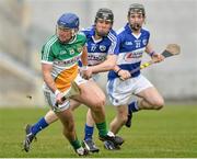 16 February 2014; Brian Carroll, Offaly, in action against Brian Stapleton and Dwane Palmer, right, Laois. Allianz Hurling League, Division 1B, Round 1, Offaly v Laois, O'Connor Park, Tullamore, Co. Offaly. Picture credit: David Maher / SPORTSFILE