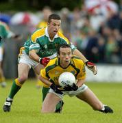 3 July 2005; Anthony Moyles, Meath, is tackled by Johnny Goldrick, Leitrim, Bank of Ireland All-Ireland Senior Football Championship Qualifier, Round 2, Leitrim v Meath, O'Moore Park, Carrick-on-Shannon, Co. Leitrim. Picture credit; Ray McManus / SPORTSFILE
