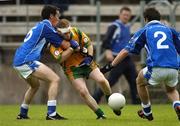 3 July 2005; Brian Roper, Donegal, in action against Martin Cahill, left, and Michael Hannon, 2, Cavan. Bank of Ireland All-Ireland Senior Football Championship Qualifier, Round 2, Cavan v Donegal, Kingspan Breffni Park, Cavan. Picture credit; Pat Murphy / SPORTSFILE