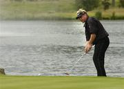 3 July 2005; Darren Clarke, Northern Ireland, watches his putt from just off the 18th green during the final round of the Smurfit European Open. K Club, Straffan, Co. Kildare. Picture credit; Matt Browne / SPORTSFILE