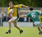 3 July 2005; Joe Sheridan, Meath, is tackled by Barry McWeeney, Leitrim. Bank of Ireland All-Ireland Senior Football Championship Qualifier, Round 2, Leitrim v Meath, Sean McDiarmuid Park, Carrick-on-Shannon, Co. Leitrim. Picture credit; Ray McManus / SPORTSFILE