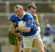 3 July 2005; Jason O'Reilly, Cavan, in action against Barry Monaghan, Donegal. Bank of Ireland All-Ireland Senior Football Championship Qualifier, Round 2, Cavan v Donegal, Kingspan Breffni Park, Cavan. Picture credit; Pat Murphy / SPORTSFILE