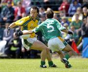 3 July 2005; Anthony Moyles, Meath, is tackled by Colin Regan, Leitrim. Bank of Ireland All-Ireland Senior Football Championship Qualifier, Round 2, Leitrim v Meath, Sean McDiarmuid Park, Carrick-on-Shannon, Co. Leitrim. Picture credit; Ray McManus / SPORTSFILE