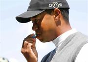 4 July 2005; Tiger Woods applies some sun screen before tee off at the JP McManus Invitational Pro-Am. Adare Manor Hotel & Golf Resort, Adare, Co. Limerick. Picture credit; Kieran Clancy / SPORTSFILE