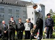 4 July 2005; Tiger Woods tees off at the 16th hole watched by JP McManus and Joe McKenna, second from left, during the JP McManus Invitational Pro-Am. Adare Manor Hotel & Golf Resort, Adare, Co. Limerick. Picture credit; Kieran Clancy / SPORTSFILE