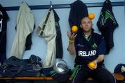 5 July 2005; Ireland's Peter Gillespie juggles oranges in the dressing room as he waits for the rain to stop. ICC Trophy, Group A, Ireland v USA, Warringstown, Co. Down. Picture credit; Damien Eagers / SPORTSFILE