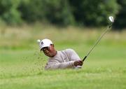 5 July 2005; Tiger Woods plays from a bunker at the 9th hole in action during the JP McManus Invitational Pro-Am. Adare Manor Hotel & Golf Resort, Adare, Co. Limerick. Picture credit; Kieran Clancy / SPORTSFILE