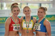 16 February 2014; Winner of the women's 60m hurdles event Sarah Lavin, UCD A.C., Dublin, centre, with second place Catherine McManus, Celtic DCH A.C., Dublin, right, and third place Lillyann O'Hora, Dooneen A.C., Limerick. Woodie’s DIY National Senior Indoor Track and Field Championships - Sunday. Athlone Institute of Technology International Arena, Athlone, Co. Westmeath. Picture credit: Stephen McCarthy / SPORTSFILE