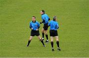 16 February 2014; Referee Eamon O'Grady, left, warms up before the game with linesmen Shane Hehir, centre and James Molloy. M Donnelly Interprovincial Football Championship, Semi-Final, Leinster v Ulster, Páirc Táilteann, Navan, Co. Meath. Picture credit: Piaras Ó Mídheach / SPORTSFILE