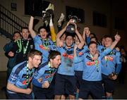 18 February 2014; The University College Dublin team celebrate as Samir Belhout lifts the cup after vioctory over IT Carlow. UMBRO CUFL Premier Division Final, IT Carlow v University College Dublin, Frank Cooke Park, Tolka Rovers FC, Dublin. Picture credit: Pat Murphy / SPORTSFILE