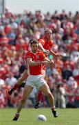 26 June 2005; Patsy Bradley, Derry, in action against, Paul McGrane, Armagh. Bank of Ireland Ulster Senior Football Championship Semi-Final, Armagh v Derry, Casement Park, Belfast. Picture Credit; David Maher / SPORTSFILE