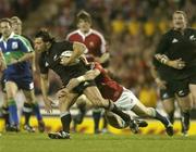 9 July 2005; Byron Kelleher, New Zealand, is tackled by Josh Lewsey, British and Irish Lions. British and Irish Lions Tour to New Zealand 2005, 3rd Test, New Zealand v British and Irish Lions, Eden Park, Auckland, New Zealand. Picture credit; Brendan Moran / SPORTSFILE