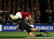 9 July 2005; Paul O'Connell, British and Irish Lions, is tackled by Byron Kelleher, New Zealand. British and Irish Lions Tour to New Zealand 2005, 3rd Test, New Zealand v British and Irish Lions, Eden Park, Auckland, New Zealand. Picture credit; Brendan Moran / SPORTSFILE