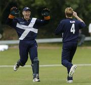 9 July 2005; Scotland wicket-keeper Douglas Lockhart, left, celebrates after a catch off the bat of Clay Smith, Bermuda, from a bowl of team-mate John Blain during the 23rd over. ICC Trophy Semi-Final, Scotland v Bermuda, The Hills, Milverton, Skerries, Co. Dublin. Picture credit; David Maher / SPORTSFILE