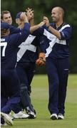 9 July 2005; Scotland bowler Paul Hoffmann, right, is congratulated by team-mates after clean bowling Bermuda's batsman Janeiro Tucket during the 30th over. ICC Trophy Semi-Final, Scotland v Bermuda, The Hills, Milverton, Skerries, Co. Dublin. Picture credit; David Maher / SPORTSFILE