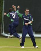 9 July 2005; Kyle McCallan, Ireland, celebrates with team-mate Trent Johnston, right, after he had bowled Canada's Desmond Chumney out for 35 runs. ICC Trophy Semi-Final, Ireland v Canada, Castle Avenue, Clontarf, Dublin. Picture credit; Brian Lawless / SPORTSFILE