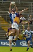 9 July 2005; Paul Finlay, Monaghan, wins possession ahead of Diarmuid Kinsella, Wexford. Bank of Ireland All-Ireland Senior Football Championship Qualifier, Round 2, Monaghan v Wexford, St. Tighernach's Park, Clones, Co. Monaghan. Picture credit; Pat Murphy / SPORTSFILE