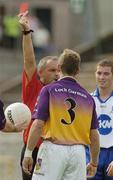 9 July 2005; Niall Murphy, Wexford, is shown the red card by referee Pat McGovern. Bank of Ireland All-Ireland Senior Football Championship Qualifier, Round 2, Monaghan v Wexford, St. Tighernach's Park, Clones, Co. Monaghan. Picture credit; Pat Murphy / SPORTSFILE