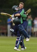 9 July 2005; Ireland's Andrew White, right, celebrates with team-mate Peter Gillespie after hitting a six to win the game in the final over. ICC Trophy Semi-Final, Ireland v Canada, Castle Avenue, Clontarf, Dublin. Picture credit; Brian Lawless / SPORTSFILE