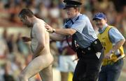 9 July 2005; A Garda catches a streaker who ran onto the field. Guinness All-Ireland Senior Hurling Championship Qualifier, Round 3, Limerick v Galway, Gaelic Grounds, Limerick. Picture credit; Damien Eagers / SPORTSFILE