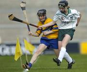 9 July 2005; Erica Minogue, Clare, is tackled by Niamh Mulcahy, Limerick. Munster Junior Camogie Championship Final, Limerick v Clare, Gaelic Grounds, Limerick. Picture credit; Damien Eagers / SPORTSFILE