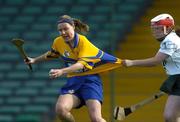 9 July 2005; Catherine O'Loughlin, Clare, is tackled by Catherine Hayes, Limerick. Munster Junior Camogie Championship Final, Limerick v Clare, Gaelic Grounds, Limerick. Picture credit; Damien Eagers / SPORTSFILE