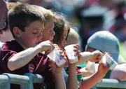 10 July 2005; Children enjoying ice-cream before the start of the game. Bank of Ireland Connacht Senior Football Championship Final, Galway v Mayo, Pearse Stadium, Galway. Picture credit; David Maher / SPORTSFILE