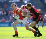 10 July 2005; Stefan Forker, Armagh, is tackled by Gary Magee, Down. Ulster Minor Football Championship Final, Armagh v Down, Croke Park, Dublin. Picture credit; Ray McManus / SPORTSFILE