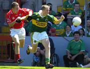10 July 2005; Paddy Curran, Kerry, is tackled by Jason O'Callaghan, Kerry. Munster Minor Football Championship Final, Cork v Kerry, Pairc Ui Chaoimh, Cork. Picture credit; Pat Murphy / SPORTSFILE