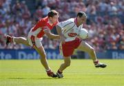 10 July 2005; Brian Dooher, Tyrone, is tackled by Kieran McGeeney, Armagh. Bank of Ireland Ulster Senior Football Championship Final, Armagh v Tyrone, Croke Park, Dublin. Picture credit; Ray McManus / SPORTSFILE